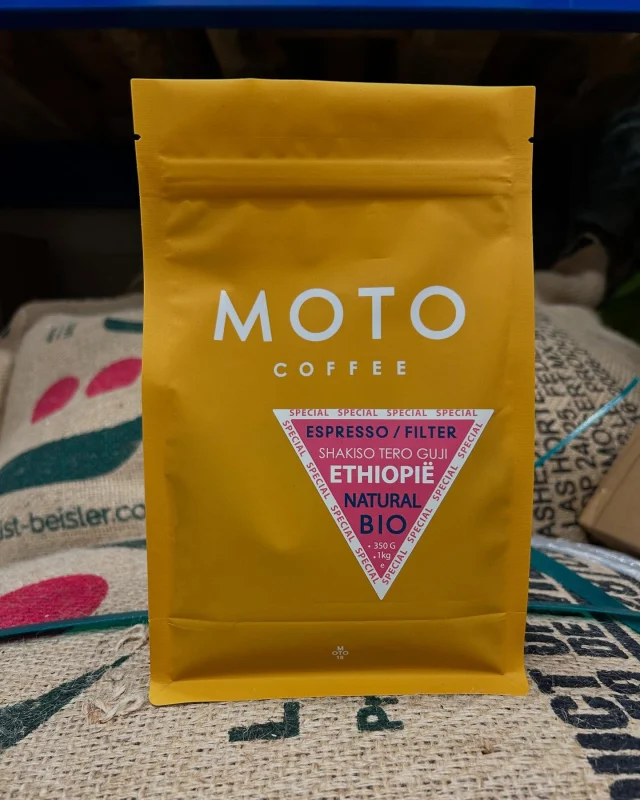 New coffee drop! 📣 

Up in the mountains of Guji, Ethiopia (1950-2210m), a special coffee grows. This 100% arabica is carefully produced by DIMTU Farm, a leading coffee producer committed to quality, sustainability, and fair cooperations with local farmers. 

DIMTU Farm is all about impact: strong partnerships, fair conditions, and a bold, transparent way of crafting exeptional coffee. 

Taste notes: medium-smooth body, stone fruit, white grape, peach, black tea & bergamot. 

Find out more about our new coffee: 🔗 in bio!

#motocoffee #motocoffeeshots #newcoffee #guji #specialtycoffee #natural #naturalprocess #ethiopia🇪🇹 #directtrade #flavour #flavournotes #special #espresso #coffee #koffie #koffiemomentje #shakiso #ethiopie
